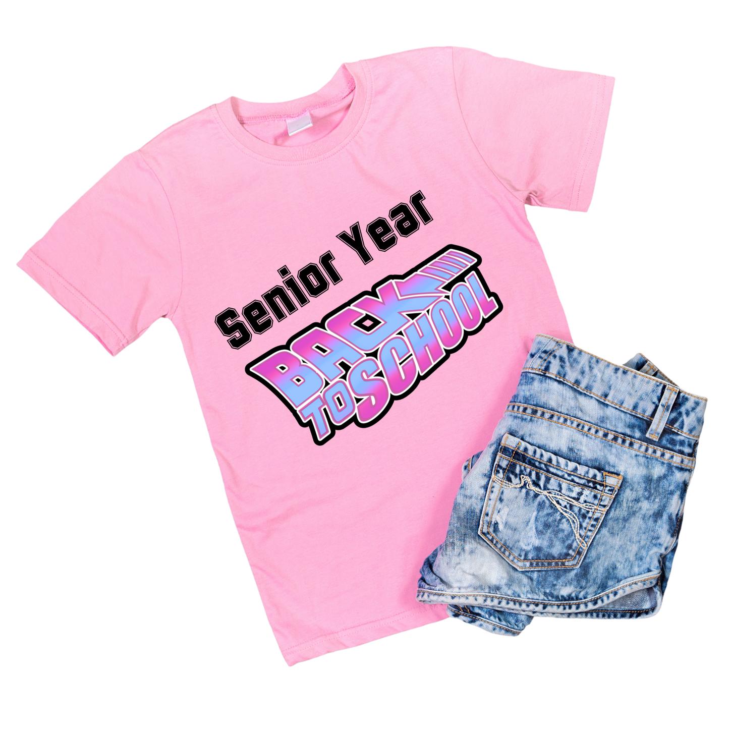 Pink t-shirt with 'Senior Year' text and denim shorts on a white background